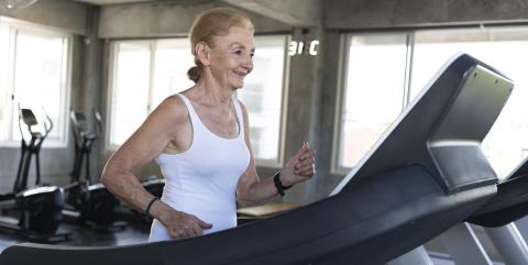Older woman walking on a treadmill