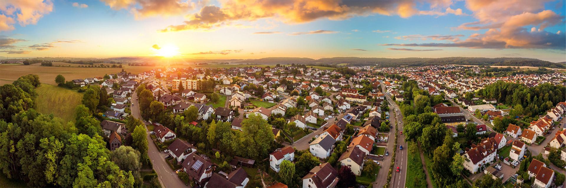 Aerial panorama of small town at sunrise