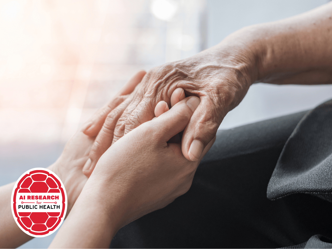 young hands hold an elder's hands