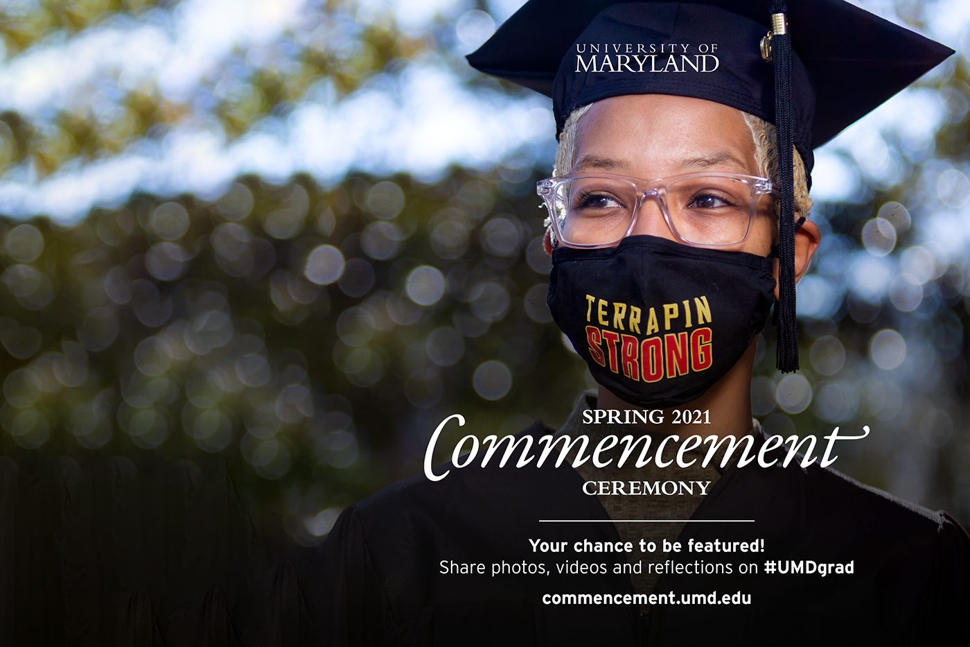 Photo of Black female student with graduation cap, short bleached hair, glasses and Terrapin Strong mask outdoors