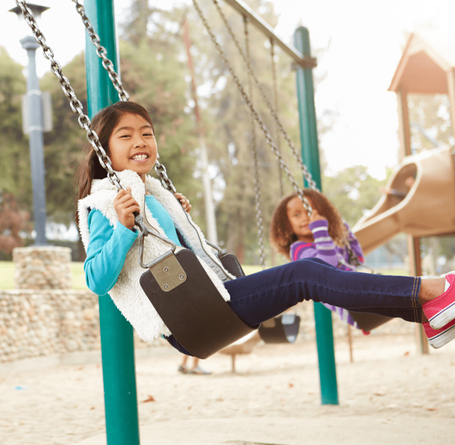 Children playing on swings